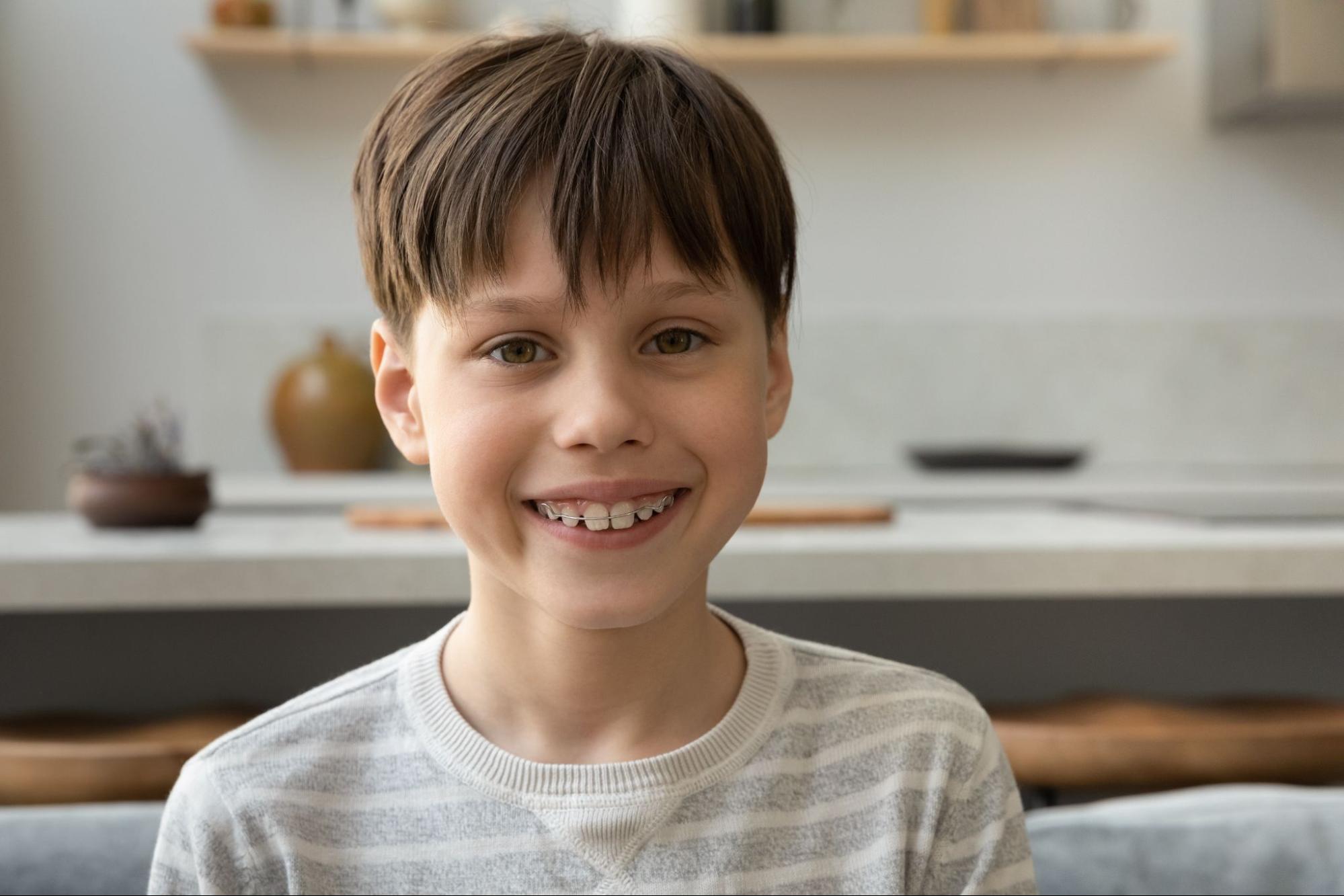 Patient with clear braces from Littleton.