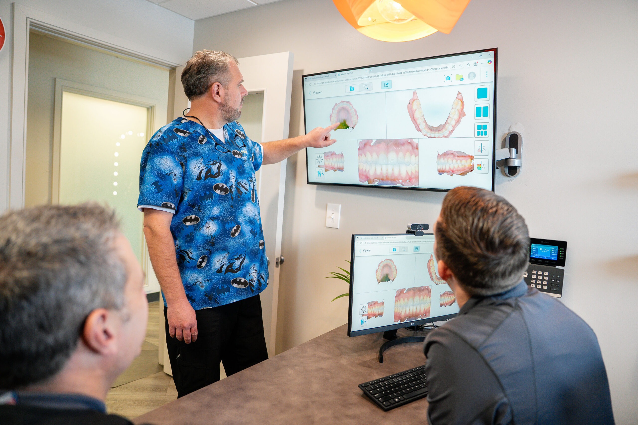 Doctos discussing orthodontic treatment at our Littleton orthodontic office.