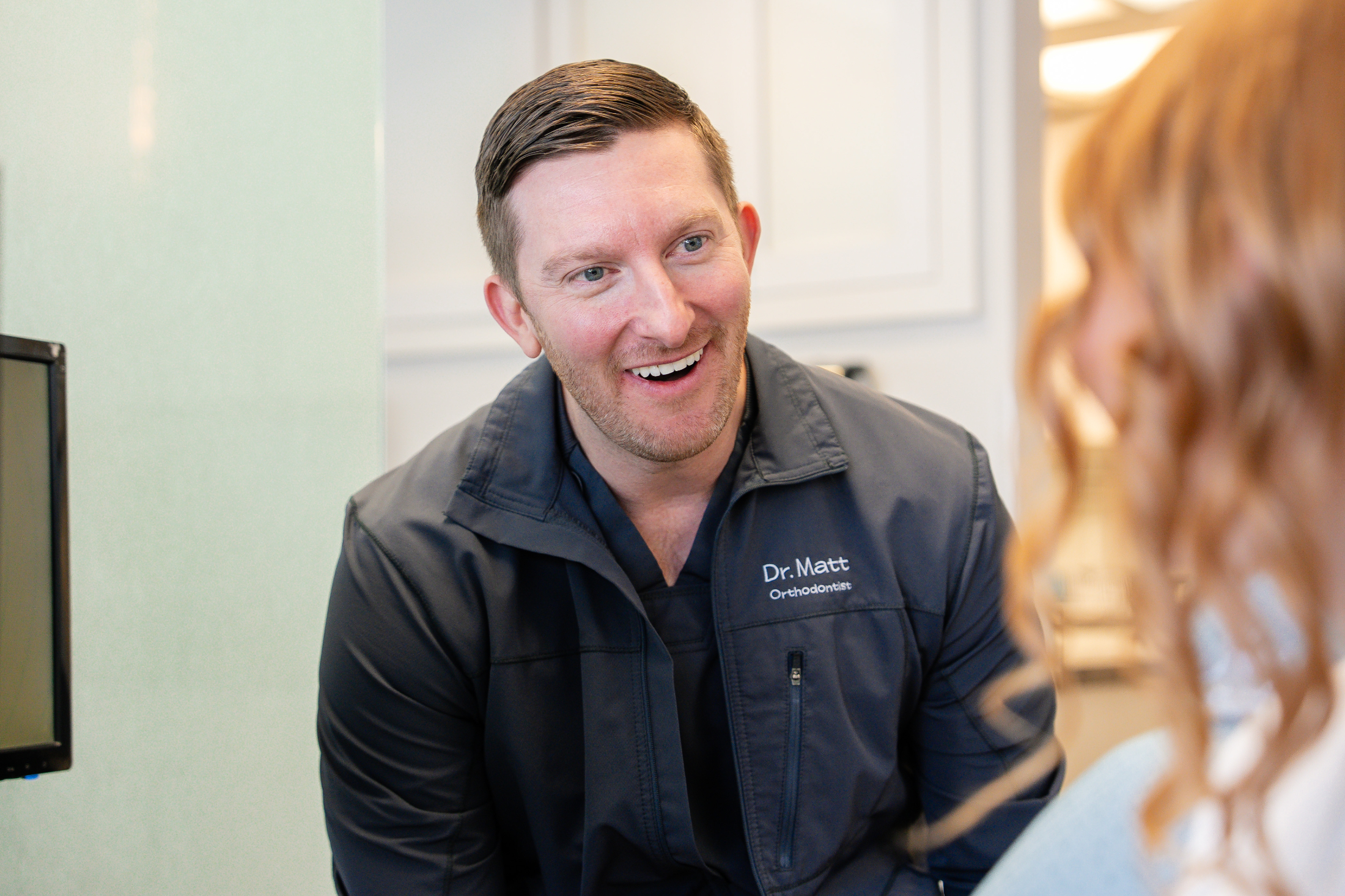 Orthodontist consulting with a patient at Southwest Pediatric Dentistry & Orthodontics, showcasing personalized care in Littleton, CO.